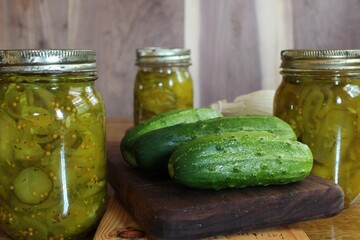 home canned pickles in glass jars made with fresh cucumbers from a family vegetable garden