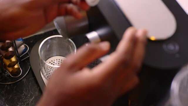 Delicious coffee being made in kitchen