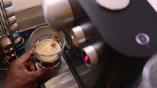 Delicious coffee being made in kitchen