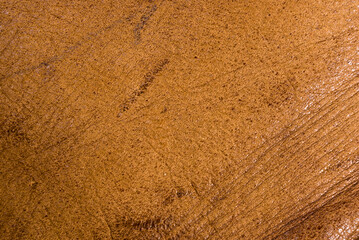 Old vintage genuine soft brown leather texture background, top layer with pores and scratches, macro, close-up