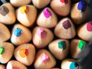 macrophotography of colored pencils on a white background. back to school concept