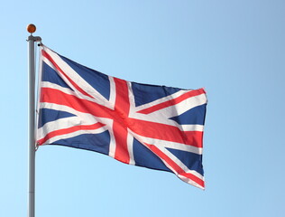 union jack flag blowing on flag pole