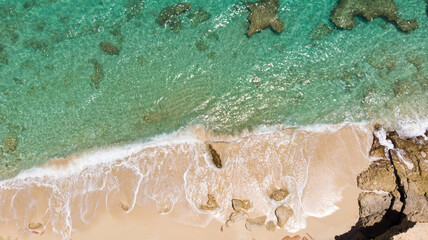 Fototapeta na wymiar Scenic aerial view of white sandy beach. White sandy beach in cupecoy St.Maarten