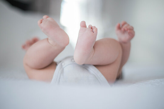 baby feet in bed stock photo royalty free 