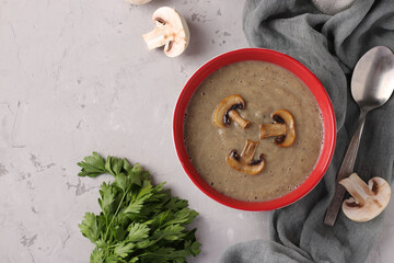 Cream soup of champignons on a light grey background, Horizontal format, Copy space