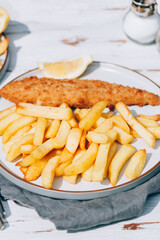 Traditional English Food such as Fish and Chips with green peas served in the Pub or Restaurant