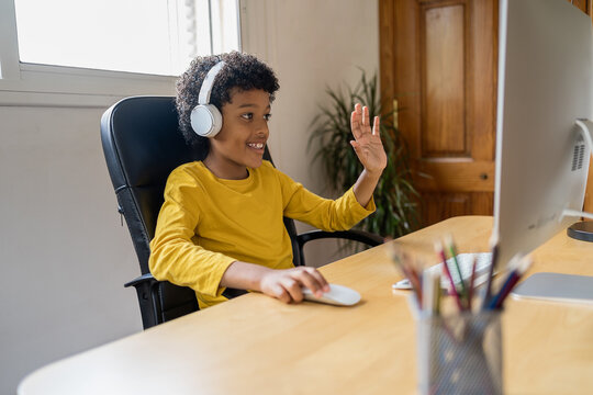 Happy African American Boy Talking Via Video Conference With His Family