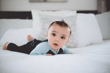 Baby boy Playing on white bed 4 months old  