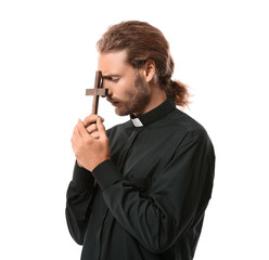 Handsome praying priest on white background