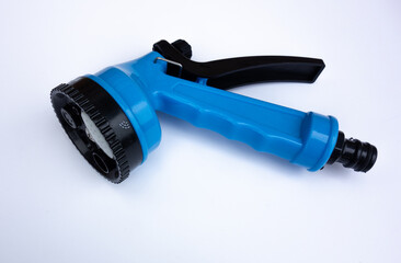 Blue watering adapter for garden hose on a white background