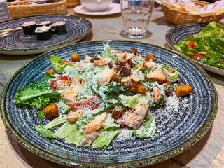 Salad with salmon, lettuce, cheese, croutons and tomatoes