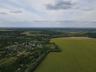 Fototapeta na wymiar Aerial view of rural summer landscape and village