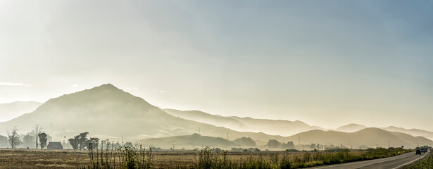 Mountains in Panorama with haze hazy fog, mist 