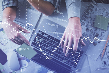 Double exposure of man and woman working together and data theme hologram drawing. Computer background. Top View.