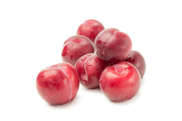 Obraz premium Seven red plums on white background, isolate