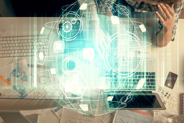Double exposure of man and woman working together and social network theme hologram drawing. Computer background. connecting concept. Top View.
