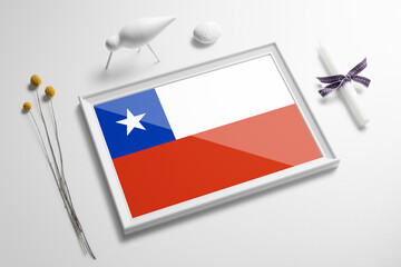 Chile flag in wooden frame on table. White natural soft concept, national celebration theme.