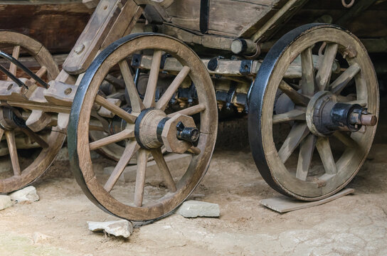 Close up of old wooden carriage wheels 