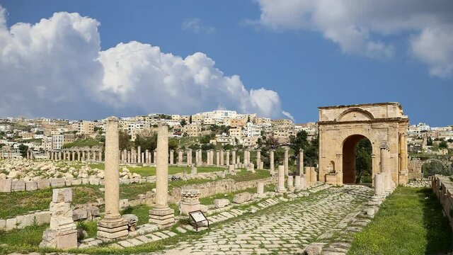 Roman ruins in the Jordanian city of Jerash (Gerasa of Antiquity), capital and largest city of Jerash Governorate, against the background of moving clouds, Jordan  