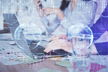 Multi exposure of woman hands typing on computer and forex chart hologram drawing. Stock market analysis concept.