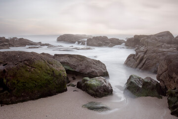 Fototapeta na wymiar Rocky sea beach long exposure