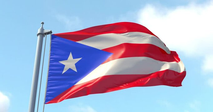 Puerto Rico flag on a flagpole waving in the wind in the sky. Wonderful intro for yor projects. The Commonwealth of Puerto Rico.