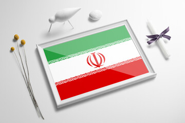 Iran flag in wooden frame on table. White natural soft concept, national celebration theme.