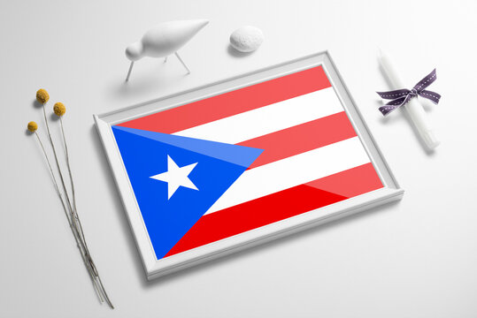 Puerto Rico flag in wooden frame on table. White natural soft concept, national celebration theme.