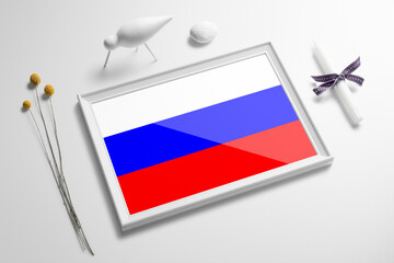 Russia flag in wooden frame on table. White natural soft concept, national celebration theme.