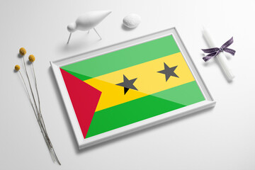 Sao Tome And Principe flag in wooden frame on table. White natural soft concept, national...