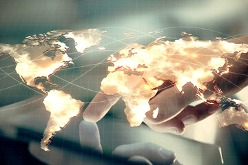 Double exposure of man's hands holding and using a phone and international business theme drawing.