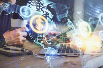Double exposure of man's hands holding and using a phone and financial graph drawing. Analysis concept.