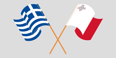 Obraz premium Crossed and waving flags of Malta and Greece