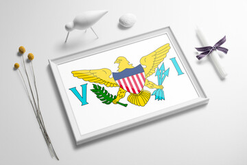 United States Virgin Islands flag in wooden frame on table. White natural soft concept, national celebration theme.