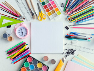 Flatley: school supplies laid out around a blank sheet