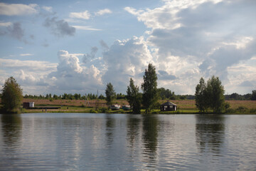 Fototapeta na wymiar Lake in the village in summer.