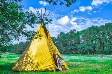 Indian house wigwam. Wigwam teepee in the forest. © Anna