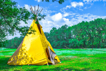 Indian house wigwam. Wigwam teepee in the forest. © Anna
