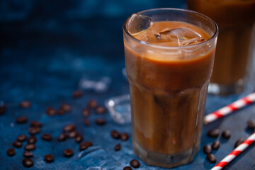 Cold summer drink, coffee with milk, coffee beans, summer mood