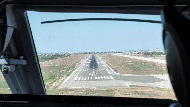 Over Shoulder Shot Pilot Landing a Commercial Airliner, Pilot's POV