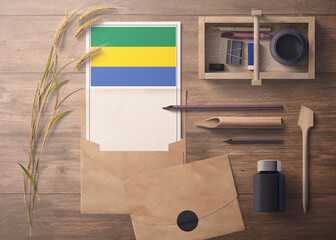 Gabon invitation, celebration letter concept. Flag with craft paper and envelope. Retro theme with...