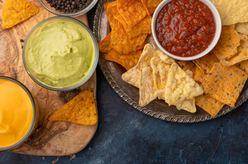Assorted chips with salsa and sauces close-up, top view, entertainment and recreation, football and watching movies