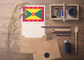 Grenada invitation, celebration letter concept. Flag with craft paper and envelope. Retro theme with divide, ink, wooden pen objects.
