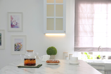 Fototapeta na wymiar Breakfast served on table in modern kitchen, space for text. Interior design