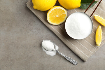 Baking soda and cut lemons on light table, flat lay