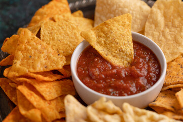Chips close-up with salsa, rest and party snacks