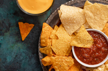 Chips close-up with salsa, rest and party snacks