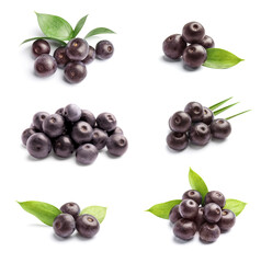 Set of fresh acai berries on white background