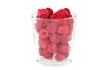 Fresh raspberries in a glass on a white background.