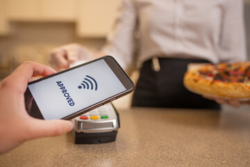 Payment for food, pizza through the terminal, wireless payment, takeaway service